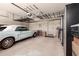 Organized garage showcasing car, storage shelves, and functional overhead storage solutions at 579 E Mary Ct, Gilbert, AZ 85295