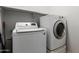 Functional laundry room with a modern washer and dryer set, maximizing space efficiency at 579 E Mary Ct, Gilbert, AZ 85295