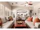 Inviting living room with hardwood floors, comfortable sofas, and seamless flow to kitchen at 579 E Mary Ct, Gilbert, AZ 85295