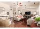 Comfortable living room with hardwood floors, ceiling fan, recessed lighting, and neutral decor at 579 E Mary Ct, Gilbert, AZ 85295