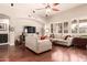 Bright and airy living room featuring hardwood floors, neutral paint, and comfortable seating at 579 E Mary Ct, Gilbert, AZ 85295