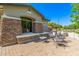 Charming outdoor patio with stone columns and comfortable seating perfect for relaxation at 579 E Mary Ct, Gilbert, AZ 85295