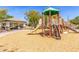 Community playground with slide and climbing structure next to a covered picnic area at 579 E Mary Ct, Gilbert, AZ 85295