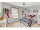 Bedroom with neutral walls, light floors, and window at 6158 W Donald Dr, Glendale, AZ 85310