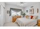 Cozy bedroom with neutral walls, light floors, and bright light at 6158 W Donald Dr, Glendale, AZ 85310