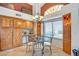 Eat-in dining area with glass table, hutch, and plenty of natural light at 6158 W Donald Dr, Glendale, AZ 85310