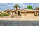 Charming single-story home with stone accents, desert landscaping, and a well-manicured front yard at 6158 W Donald Dr, Glendale, AZ 85310