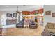 Bright open-concept with tile floors, leather seating, and seamless access to kitchen and dining areas at 6158 W Donald Dr, Glendale, AZ 85310