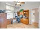 Bright office space with built-in wooden shelves and desk at 6158 W Donald Dr, Glendale, AZ 85310