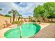Inviting backyard pool and spa area surrounded by lush greenery and mature trees for a serene and private oasis at 6158 W Donald Dr, Glendale, AZ 85310