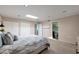 Bright bedroom features carpet, access to the ensuite bathroom, and dual closets at 6240 N 16Th St # 45, Phoenix, AZ 85016
