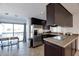 Modern kitchen with stainless steel appliances and breakfast bar at 6240 N 16Th St # 45, Phoenix, AZ 85016