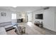 Bright living room with TV, desk, and a view of the front door at 6240 N 16Th St # 45, Phoenix, AZ 85016
