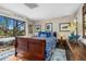 Bright bedroom with large windows, hardwood floors, and a beautiful bed with decorative pillows at 6301 N Camelback Manor Dr, Paradise Valley, AZ 85253