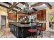Gourmet kitchen with a large island, granite countertops, and custom cabinetry at 6301 N Camelback Manor Dr, Paradise Valley, AZ 85253