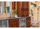 Convenient kitchen wet bar area with a stainless steel sink and a wine cooler at 6301 N Camelback Manor Dr, Paradise Valley, AZ 85253