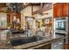 Spacious kitchen island with a sink, stainless steel appliances, and bar seating at 6301 N Camelback Manor Dr, Paradise Valley, AZ 85253