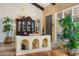 Elegant living room featuring hardwood floors, a display cabinet, and lots of light at 6301 N Camelback Manor Dr, Paradise Valley, AZ 85253