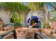 Charming outdoor area with pizza oven, comfortable seating, and stylish outdoor decor at 6301 N Camelback Manor Dr, Paradise Valley, AZ 85253
