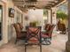 Covered patio featuring comfortable seating, a ceiling fan, and views of the outdoor landscaping at 6301 N Camelback Manor Dr, Paradise Valley, AZ 85253