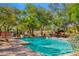 Refreshing swimming pool surrounded by a brick patio, lush landscaping, and comfortable seating for relaxation at 6301 N Camelback Manor Dr, Paradise Valley, AZ 85253