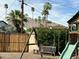 Backyard featuring a wooden swing set and slide with desert landscaping at 6340 E Mitchell Dr, Scottsdale, AZ 85251