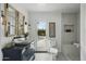 Chic bathroom with shiplap walls, patterned mirror, and a view of the outdoor pool at 6340 E Mitchell Dr, Scottsdale, AZ 85251