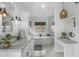Bright bathroom with double sinks, tub, vanity, tile surround, and herringbone floors at 6340 E Mitchell Dr, Scottsdale, AZ 85251