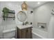Cozy bathroom with vanity, wood accents, bathtub and shower combination at 6340 E Mitchell Dr, Scottsdale, AZ 85251