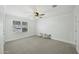 Bright bedroom with ceiling fan, window and neutral carpet and color scheme at 6340 E Mitchell Dr, Scottsdale, AZ 85251