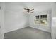 Bright bedroom with ceiling fan, window and neutral carpet and color scheme at 6340 E Mitchell Dr, Scottsdale, AZ 85251