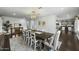 Open dining room with elegant lighting and dark wood floors at 6340 E Mitchell Dr, Scottsdale, AZ 85251