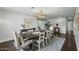 Bright dining room featuring a large wooden table with seating for eight at 6340 E Mitchell Dr, Scottsdale, AZ 85251