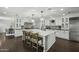 Elegant kitchen with seating at the island, stainless appliances, and stylish fixtures at 6340 E Mitchell Dr, Scottsdale, AZ 85251