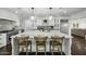 Contemporary kitchen with large island, pendant lighting, and barstool seating at 6340 E Mitchell Dr, Scottsdale, AZ 85251