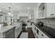 Bright kitchen with marble countertops, a farmhouse sink, and stainless steel appliances at 6340 E Mitchell Dr, Scottsdale, AZ 85251