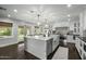 Open kitchen with a large island, backyard views, and access to outdoor dining at 6340 E Mitchell Dr, Scottsdale, AZ 85251