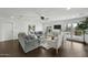 Bright living room with a gray sectional, hardwood floors, and backyard views at 6340 E Mitchell Dr, Scottsdale, AZ 85251