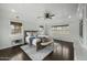Bright and airy bedroom with a decorative ceiling fan and wood floors at 6340 E Mitchell Dr, Scottsdale, AZ 85251