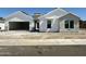 Charming new construction home featuring bright white siding and a spacious two car garage at 6460 E Omega Cir, Mesa, AZ 85215