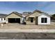 New construction shows a charming single-Gathering home with a two-car garage and neutral colors at 6460 E Omega Cir, Mesa, AZ 85215