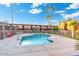 Community pool with well-maintained landscaping at condominium complex at 7110 E Continental Dr # 1044, Scottsdale, AZ 85257