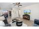 Bright living room featuring a TV, stylish furniture, and an open view to the kitchen at 7110 E Continental Dr # 1044, Scottsdale, AZ 85257