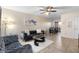 Inviting living room with tile floors, a plush rug, and a glimpse into the dining area at 7110 E Continental Dr # 1044, Scottsdale, AZ 85257