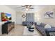 Cozy living room with stylish sofas, modern decor, and a ceiling fan for comfortable living at 7110 E Continental Dr # 1044, Scottsdale, AZ 85257