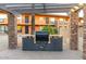Outdoor kitchen area featuring a built-in grill and stone accents at 7110 E Continental Dr # 1044, Scottsdale, AZ 85257
