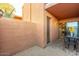 Desert style patio with brick flooring and stucco walls overlooking the home's interior at 7110 E Continental Dr # 1044, Scottsdale, AZ 85257