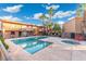 Well-maintained community pool area with lush landscaping, seating and a hot tub at 7110 E Continental Dr # 1044, Scottsdale, AZ 85257