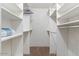 Spacious walk-in closet with ample shelving for optimal storage and organization at 7110 E Continental Dr # 1044, Scottsdale, AZ 85257