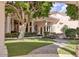 Secluded backyard with lush landscaping, beautiful trees, and a charming stone walkway at 7630 E Vaquero Dr, Scottsdale, AZ 85258